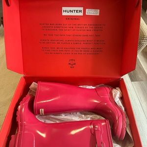 Bright pink Hunter rain boots